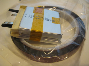 Photo of partially assembled Lithium Polymer battery pack laying on a roll of Kapton tape.