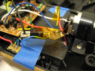 Photo of the interior showing detail of the insulating tape on the voltage regulator.