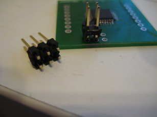 Photo detailing programming head modifications and comparison with normal header.