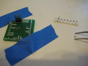 Photo showing size of 0805 resistors in comparison to the board.