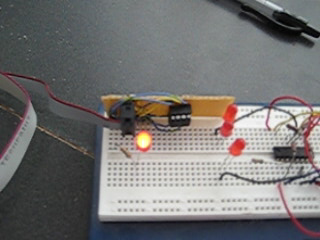 Photo of an Atmel ATtiny25 blinking an LED